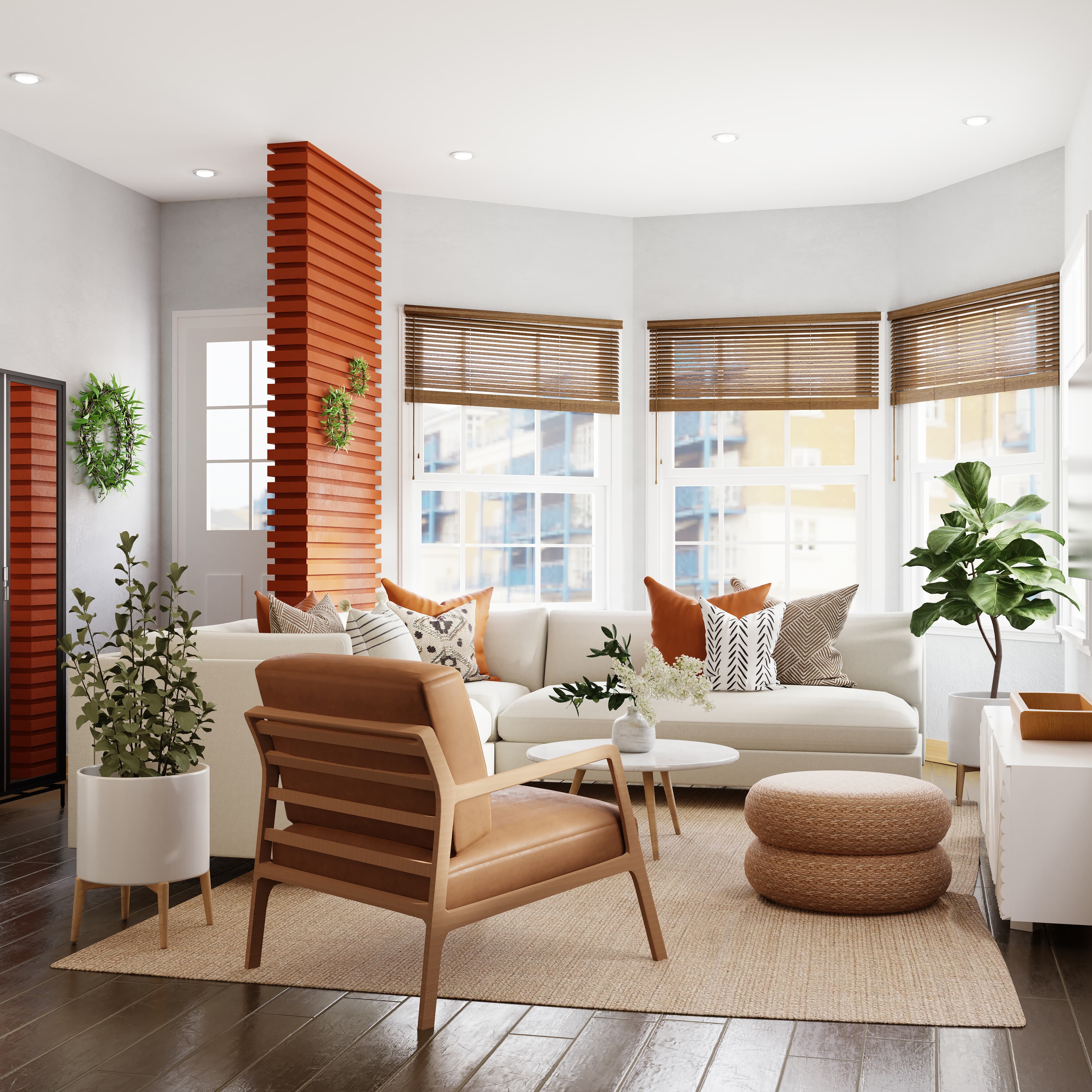 Living room with white sofa, wooden single person lounge chair.